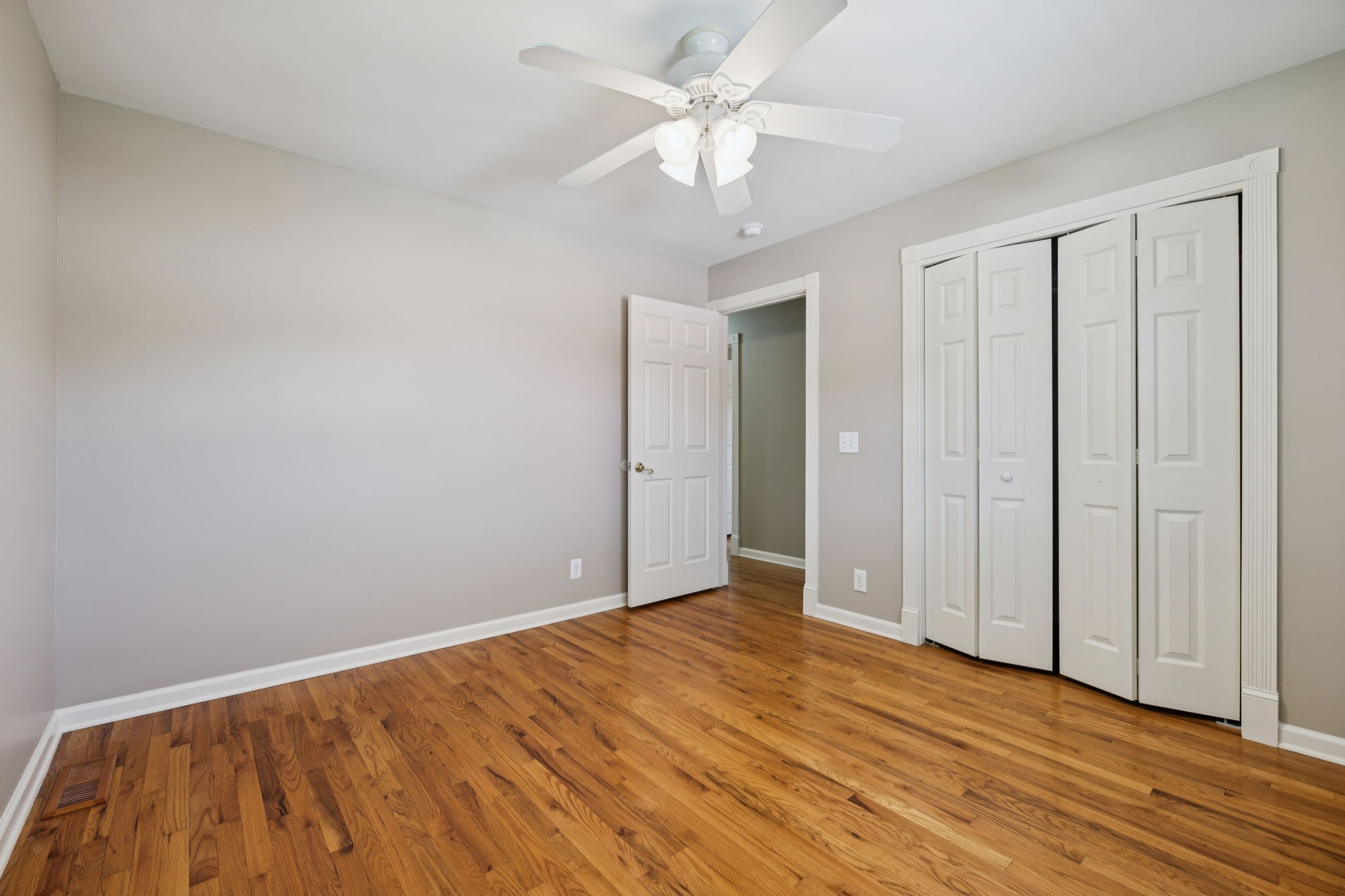 10446 Bold Springs Road McEwen, TN 37101 - Photo 23 of 54 a view of an empty room with wooden floor