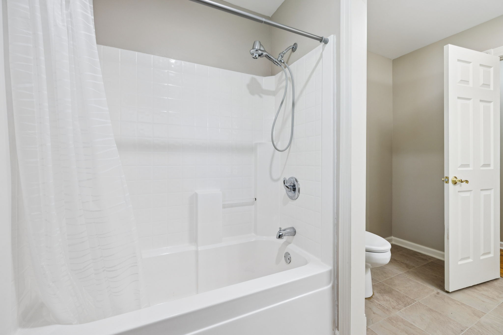 10446 Bold Springs Road McEwen, TN 37101 - Photo 26 of 54 a bathroom with a bathtub and a shower