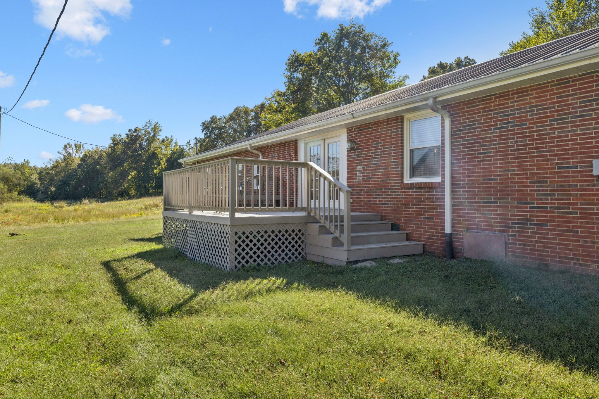 10446 Bold Springs Road McEwen, TN 37101 - Photo 30 of 54 a view of a house with backyard and fence