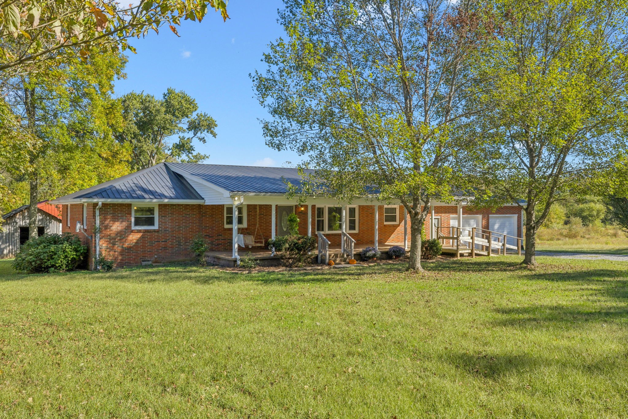 10446 Bold Springs Road McEwen, TN 37101 - Photo 3 of 54 a front view of a house with garden