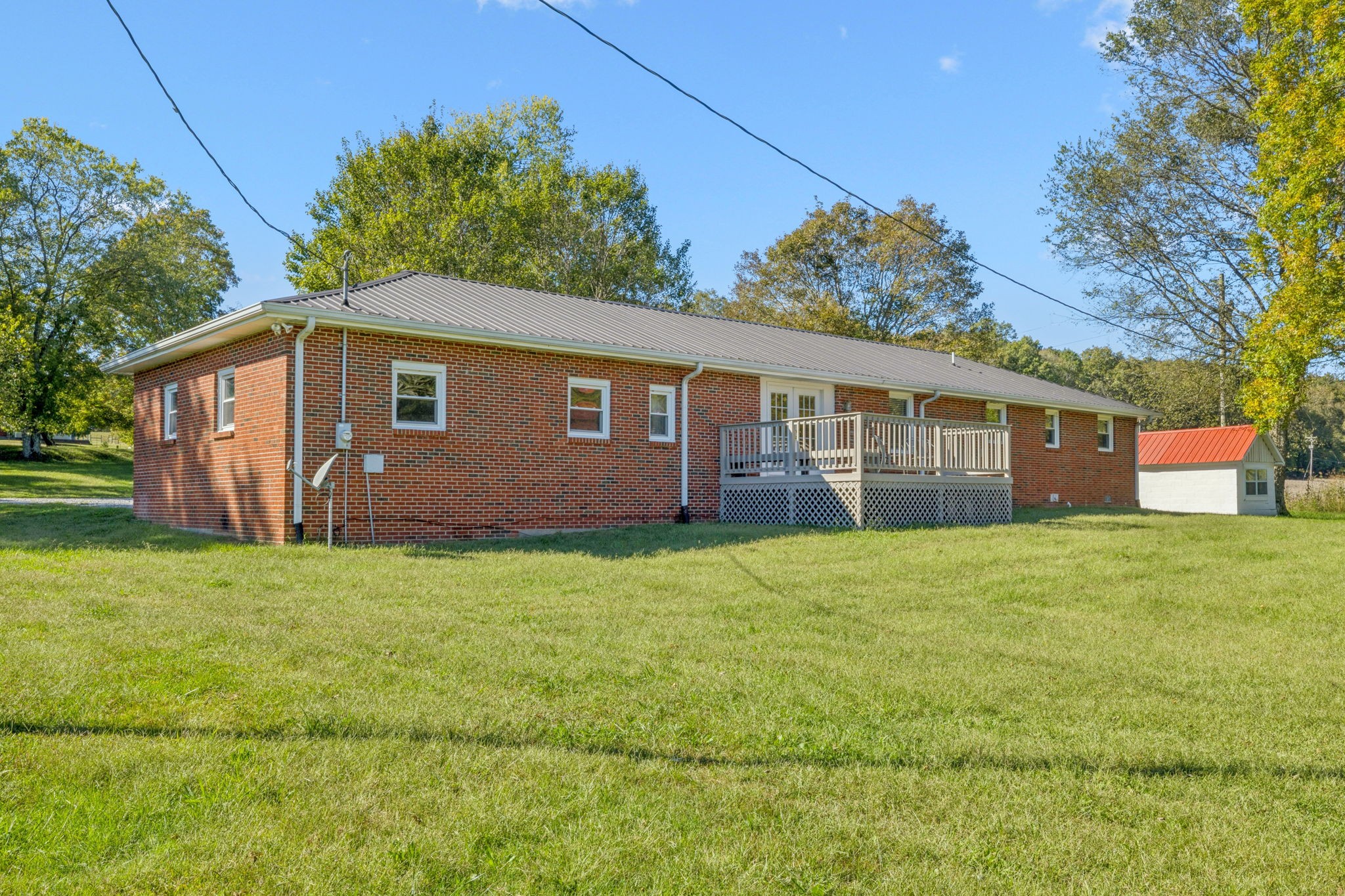 10446 Bold Springs Road McEwen, TN 37101 - Photo 39 of 54 a backyard of a house with lots of green space