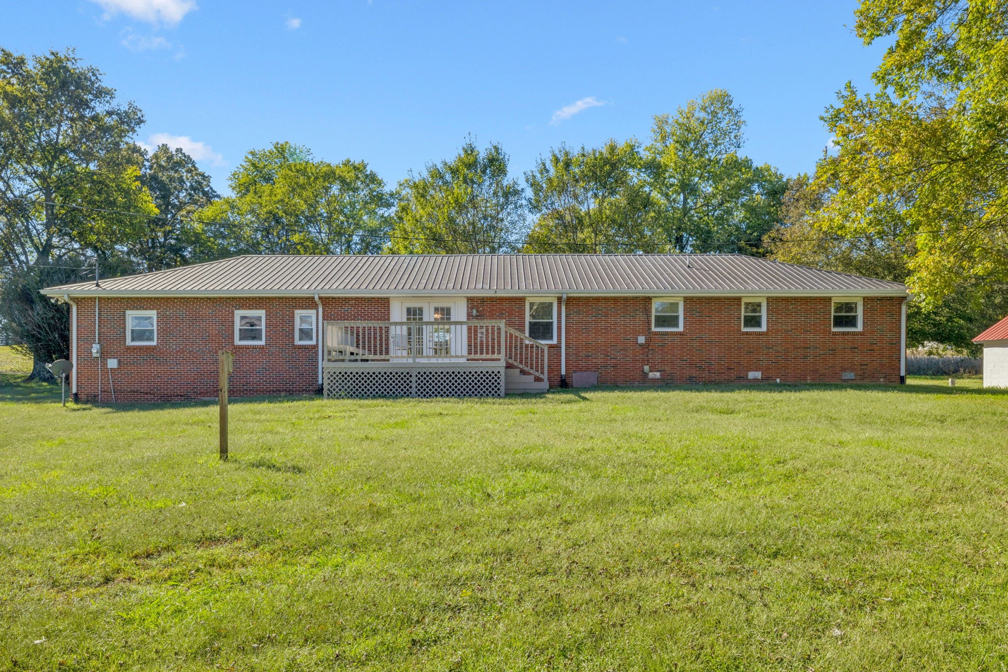 10446 Bold Springs Road McEwen, TN 37101 - Photo 40 of 54 a view of a house with a backyard