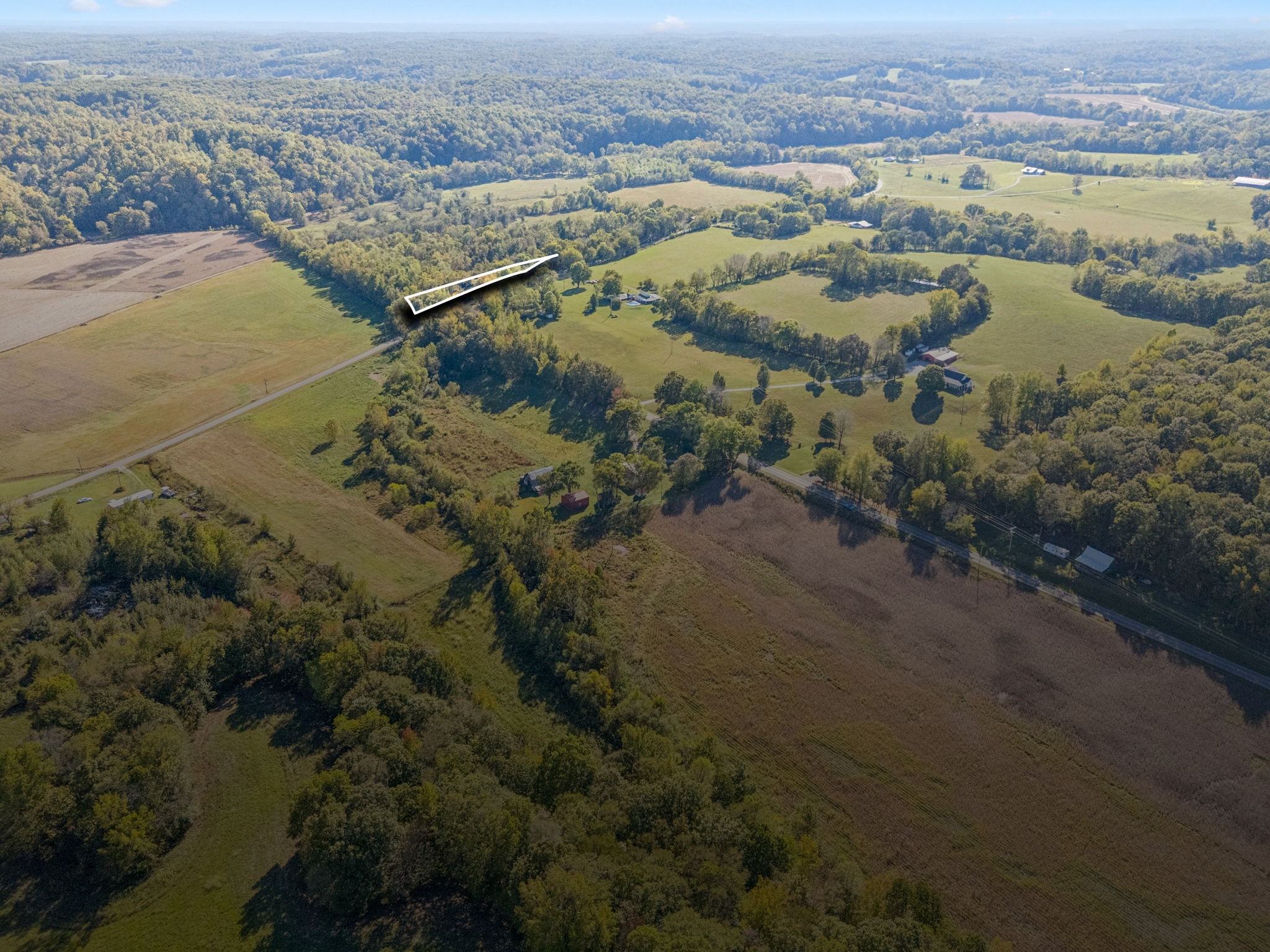 10446 Bold Springs Road McEwen, TN 37101 - Photo 53 of 54 an aerial view of ocean with residential house and lake