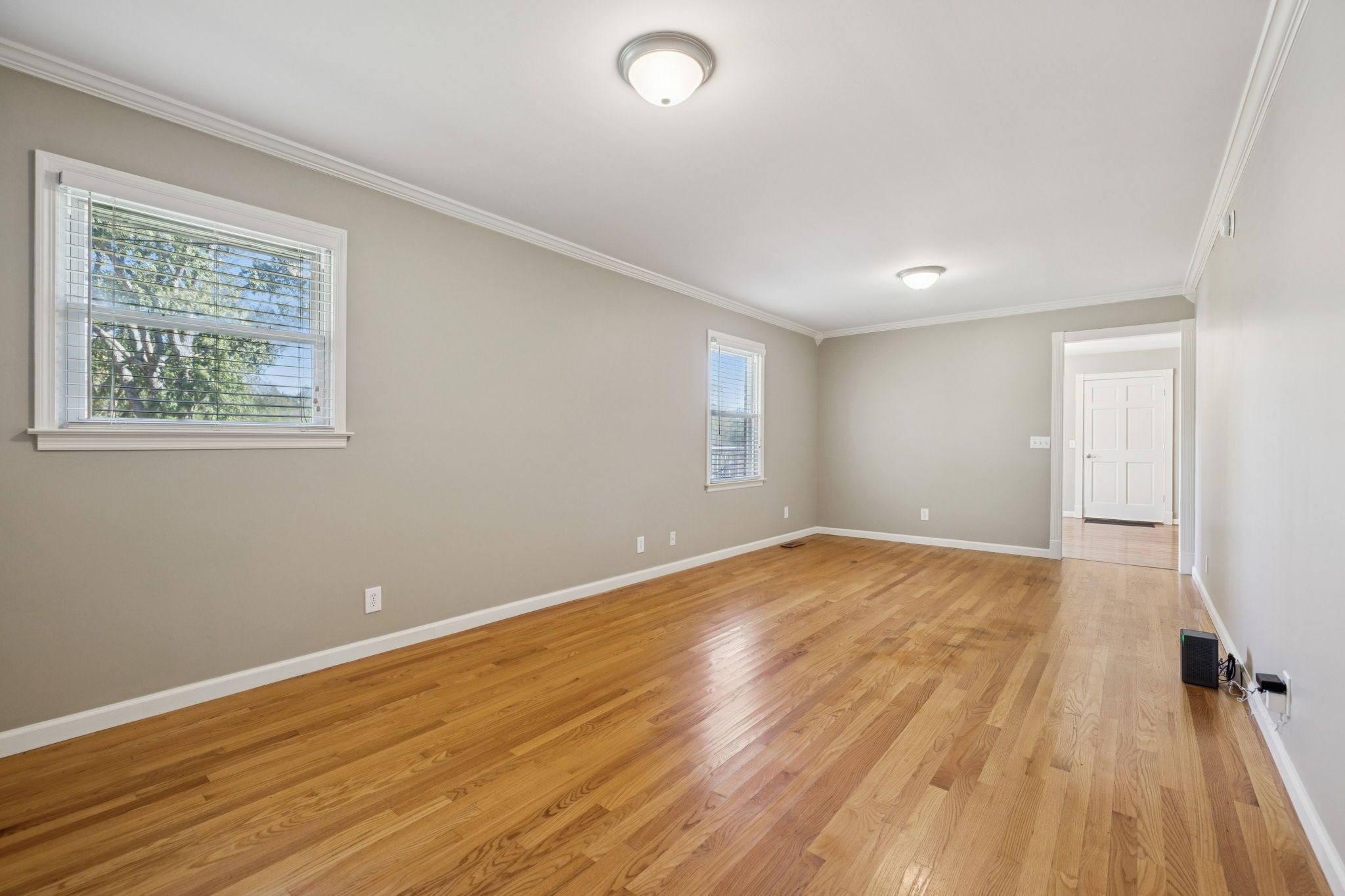 10446 Bold Springs Road McEwen, TN 37101 - Photo 10 of 54 a view of an empty room with wooden floor and a window