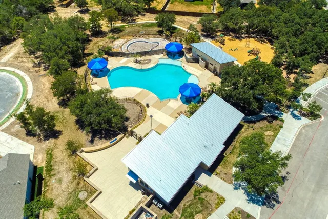 a view of a swimming pool with chairs