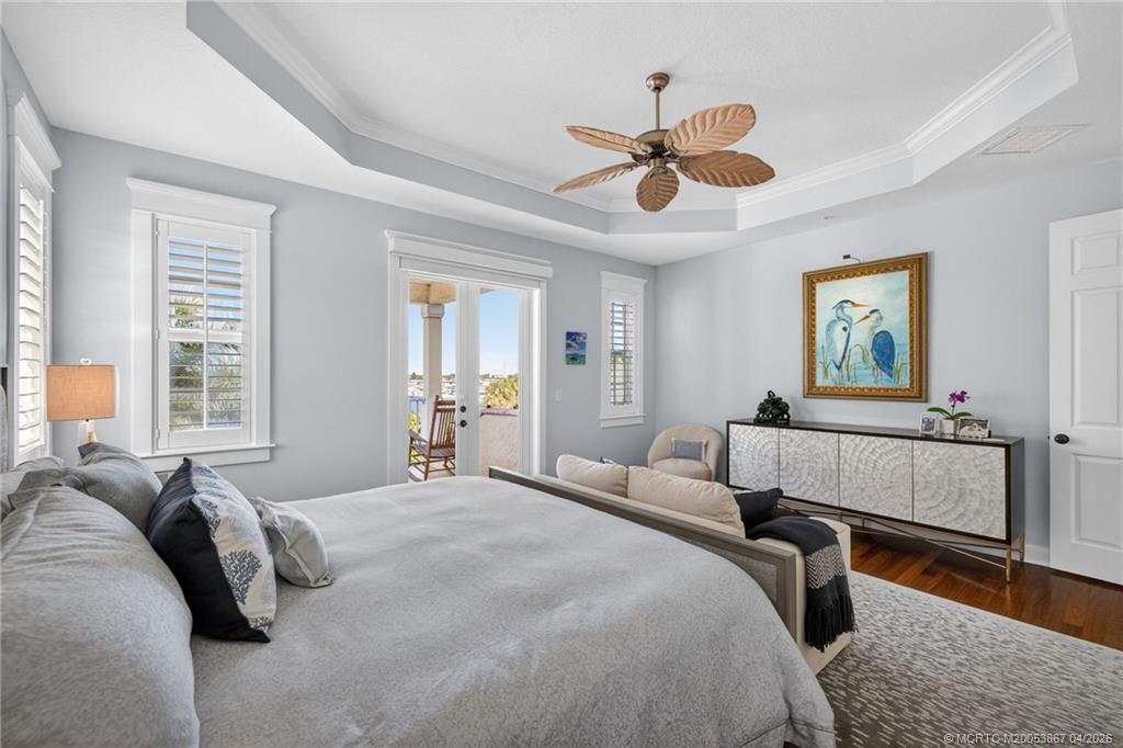 334 Southwest Atlanta Avenue Stuart, FL 34994 - Photo 25 of 56 a bedroom with a bed and window