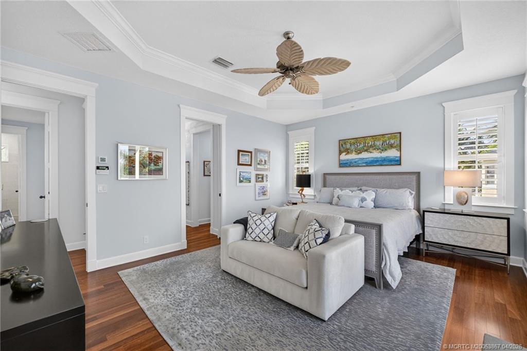 334 Southwest Atlanta Avenue Stuart, FL 34994 - Photo 26 of 56 a bed room with a bed and a couch
