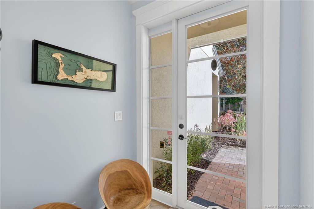 334 Southwest Atlanta Avenue Stuart, FL 34994 - Photo 45 of 56 a picture of a bathroom with wooden floor and a painting