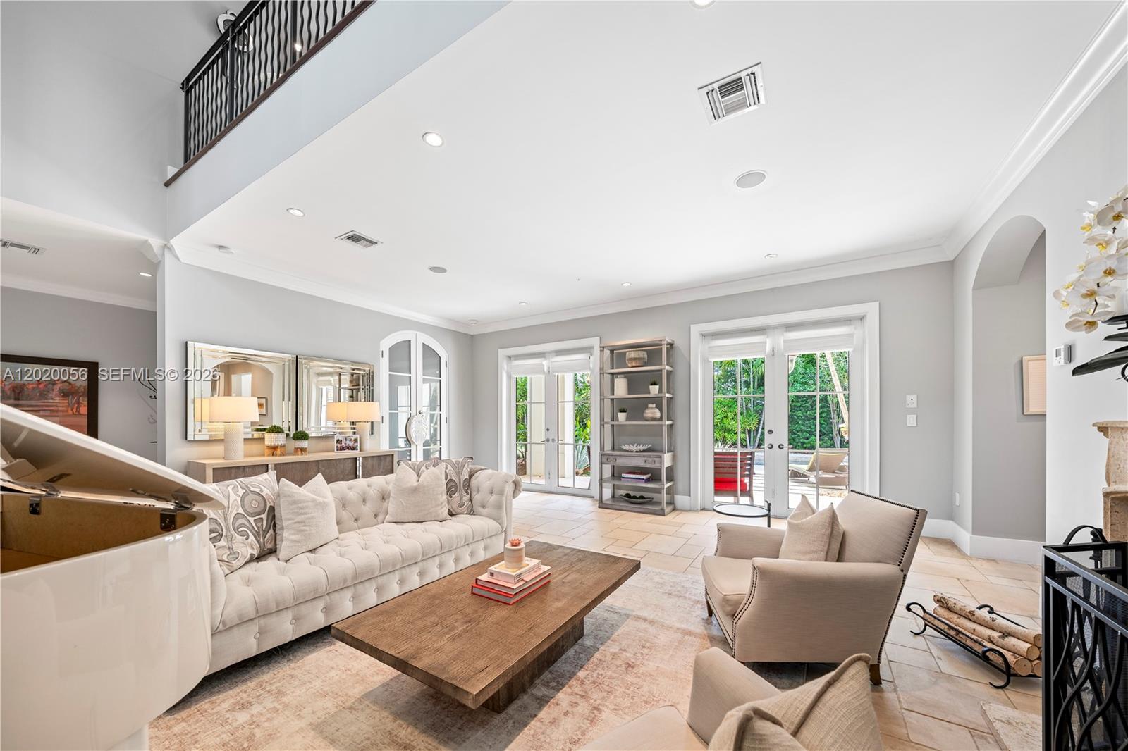 4196 Douglas Road Miami, FL 33133 - Photo 19 of 96 a living room with furniture and a large window