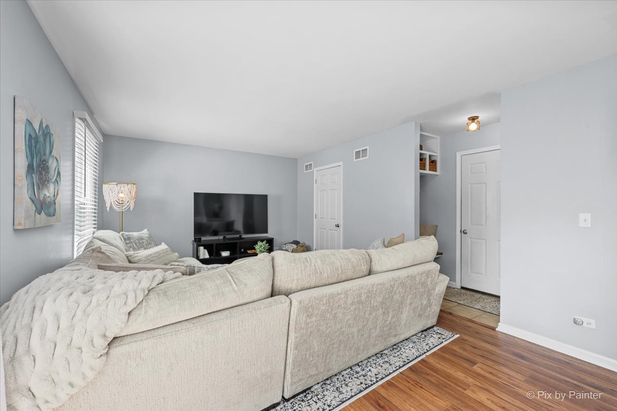1150 Appleton Lane Geneva, IL 60134 - Photo 29 of 43 a living room with furniture and a flat screen tv
