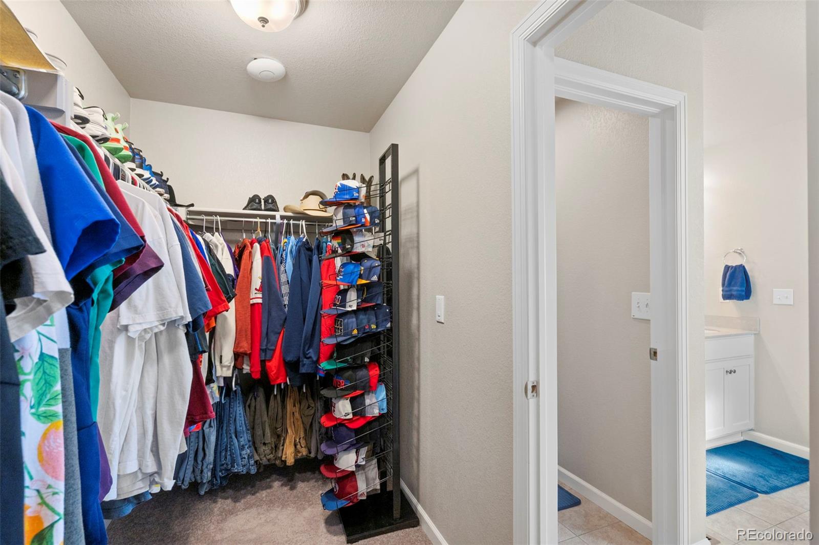11778 Oneida Street Thornton, CO 80233 - Photo 12 of 30 a view of walk in closet with clothes