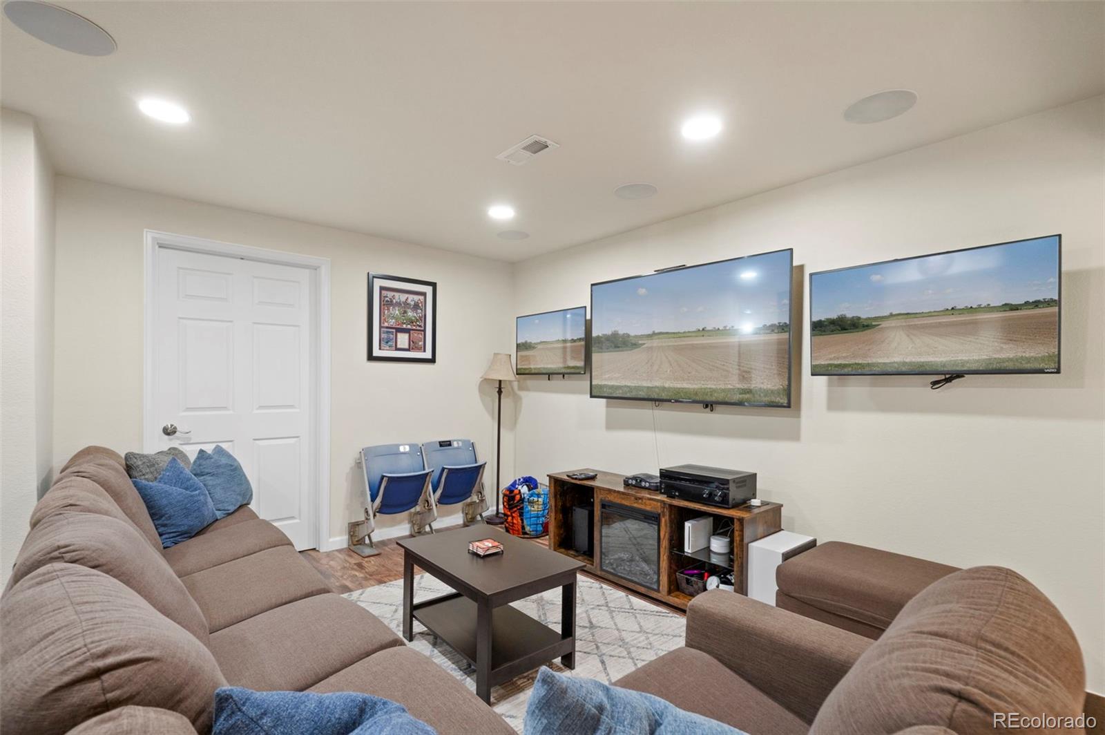 11778 Oneida Street Thornton, CO 80233 - Photo 20 of 30 a living room with furniture and a flat screen tv