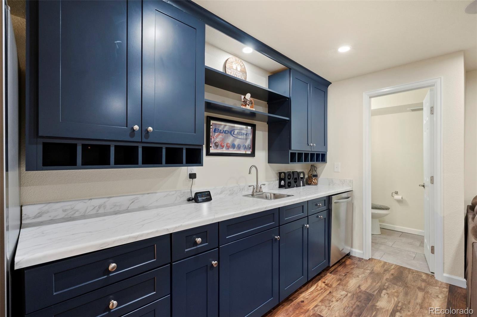 11778 Oneida Street Thornton, CO 80233 - Photo 22 of 30 a spacious bathroom with a sink and a mirror