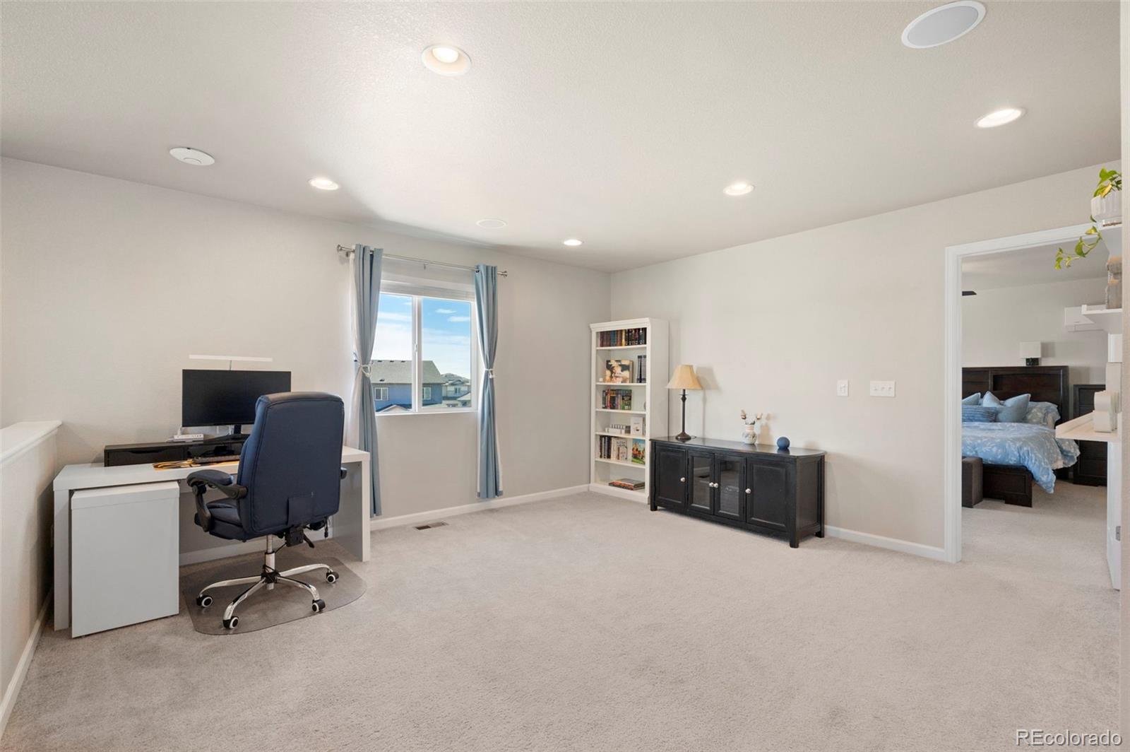 11778 Oneida Street Thornton, CO 80233 - Photo 9 of 30 a view of workspace with livingroom