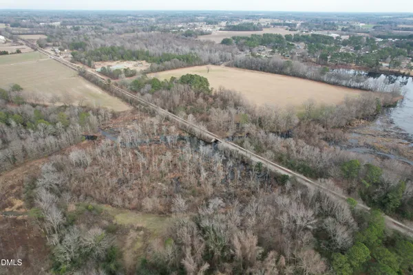 an aerial view of a houses with a yard