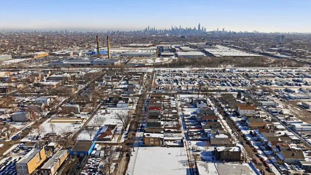 a picture of a bench in front of a wall