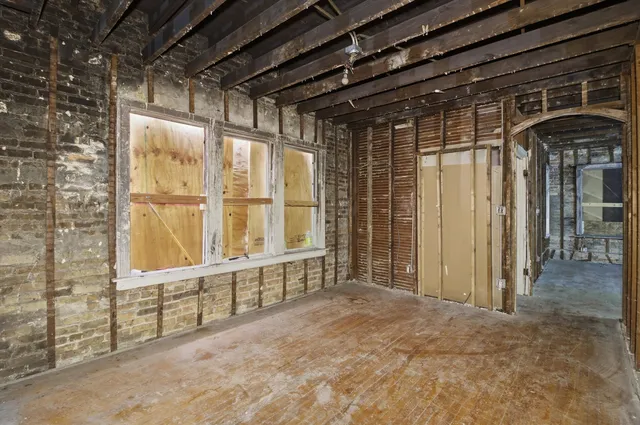 a view of an empty room with a balcony