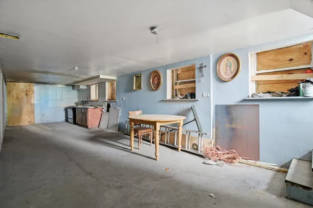 a close up of a storage and utility room with a washer and dryer