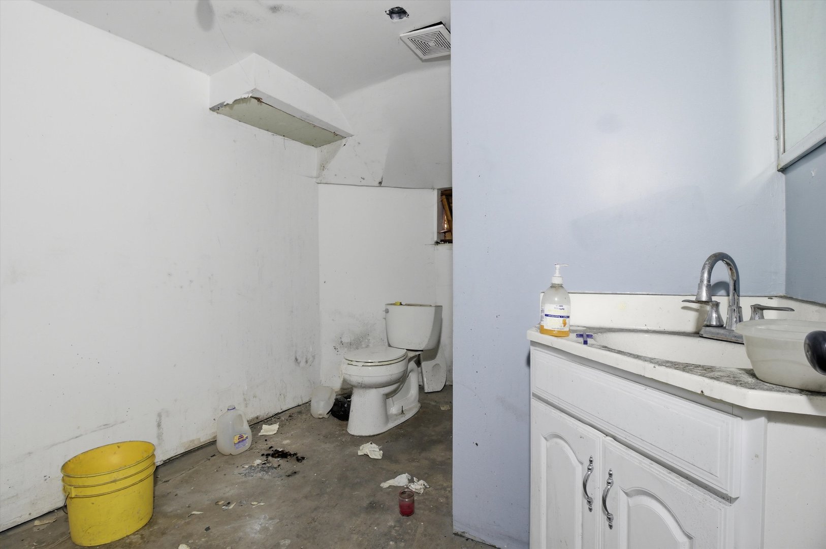 4745 West Ohio Street Chicago, IL 60644 - Photo 6 of 15 a bathroom with a sink and a toilet