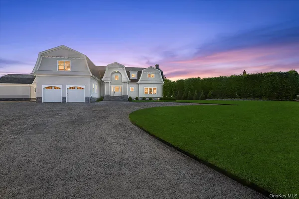 a view of a big house with a big yard