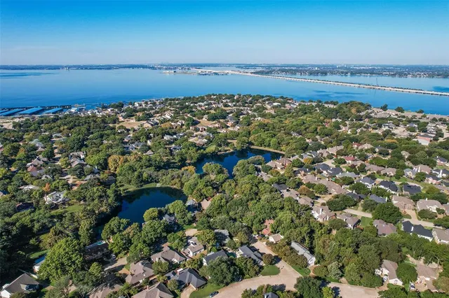 front view of a house with a tree in a yard