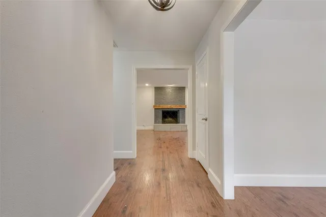 a view of a hallway view of wooden floor