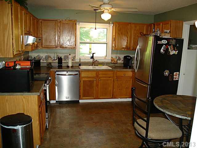 2311 Lawrence Road Clover, SC 29710 - Photo 2 of 8 a kitchen with stainless steel appliances granite countertop a refrigerator a stove a sink dishwasher and a microwave