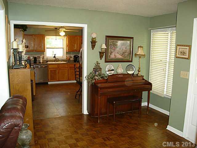 2311 Lawrence Road Clover, SC 29710 - Photo 5 of 8 a living room with a table chairs and a refrigerator