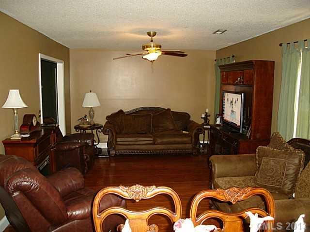 2311 Lawrence Road Clover, SC 29710 - Photo 7 of 8 a living room with furniture and a chandelier