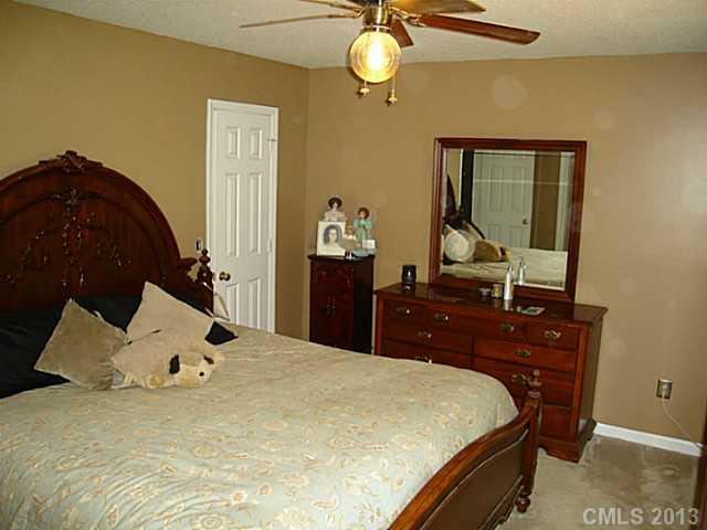 2311 Lawrence Road Clover, SC 29710 - Photo 8 of 8 a bed sitting in a bedroom next to a window and dresser