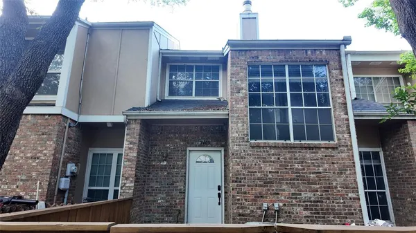 a front view of a house with glass windows