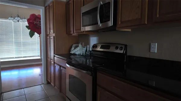 a kitchen with a stove and a microwave