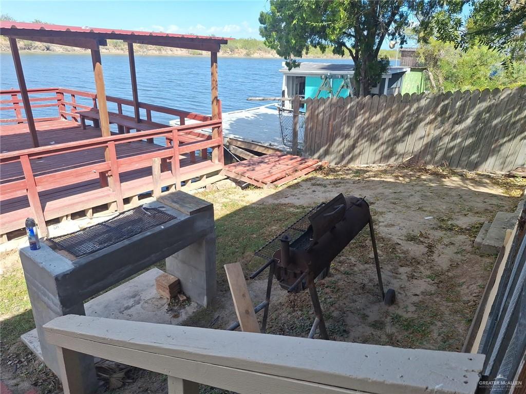 36789 Marshall Hutts Road Rio Hondo, TX 78583 - Photo 3 of 7 a view of a balcony with two chairs and a table