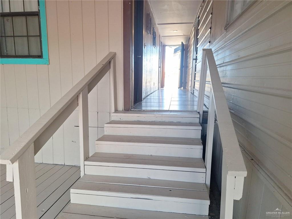 36789 Marshall Hutts Road Rio Hondo, TX 78583 - Photo 6 of 7 a view of staircase with wooden floor and white walls