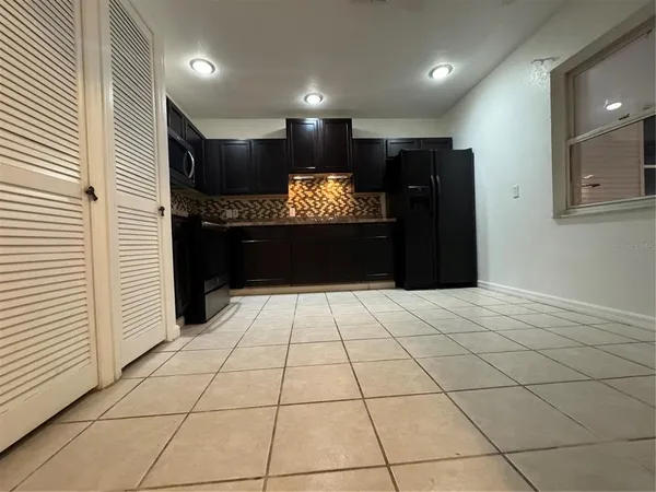 a view of an empty room and a window