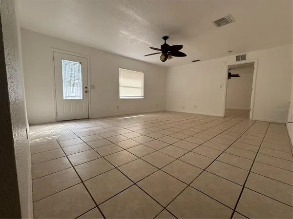 a view of an empty room and window