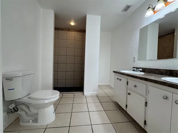 a view of a hallway with a shower