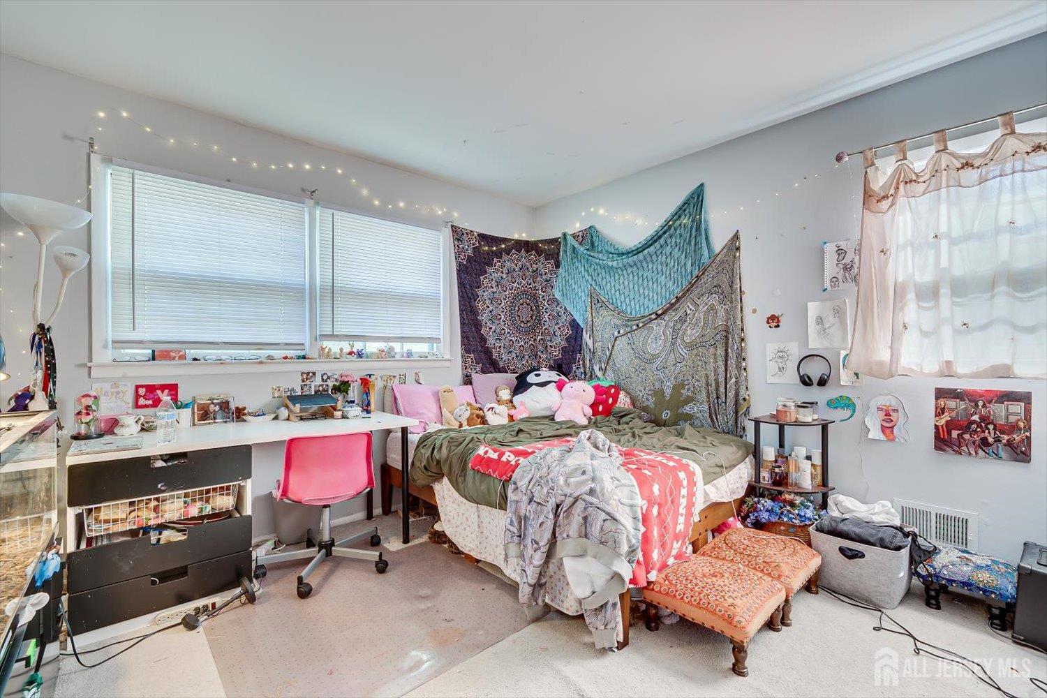 12 Gales Road Edison, NJ 08837 - Photo 20 of 35 a bedroom with a bed and a chandelier