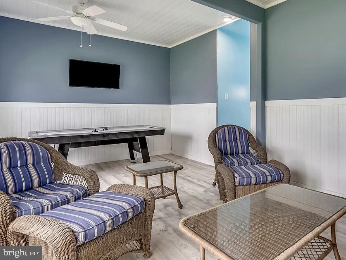 21642 Chicken Point Road Tilghman, MD 21671 - Photo 52 of 63 a living room with furniture and a flat screen tv