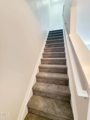 a view of a storage & utility room with a window