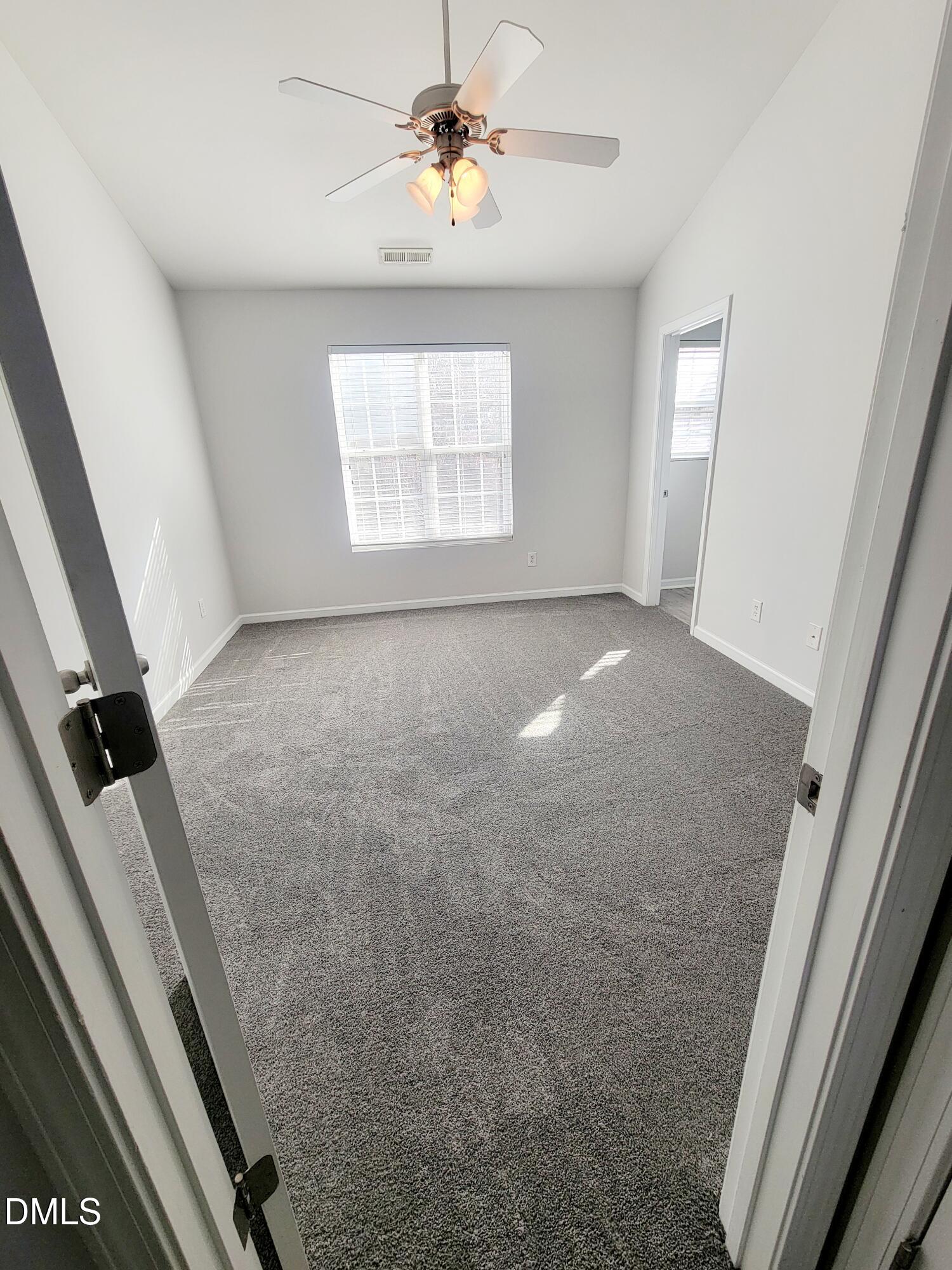 1407 Plexor Lane Knightdale, NC 27545 - Photo 17 of 43 a view of an empty room with a window
