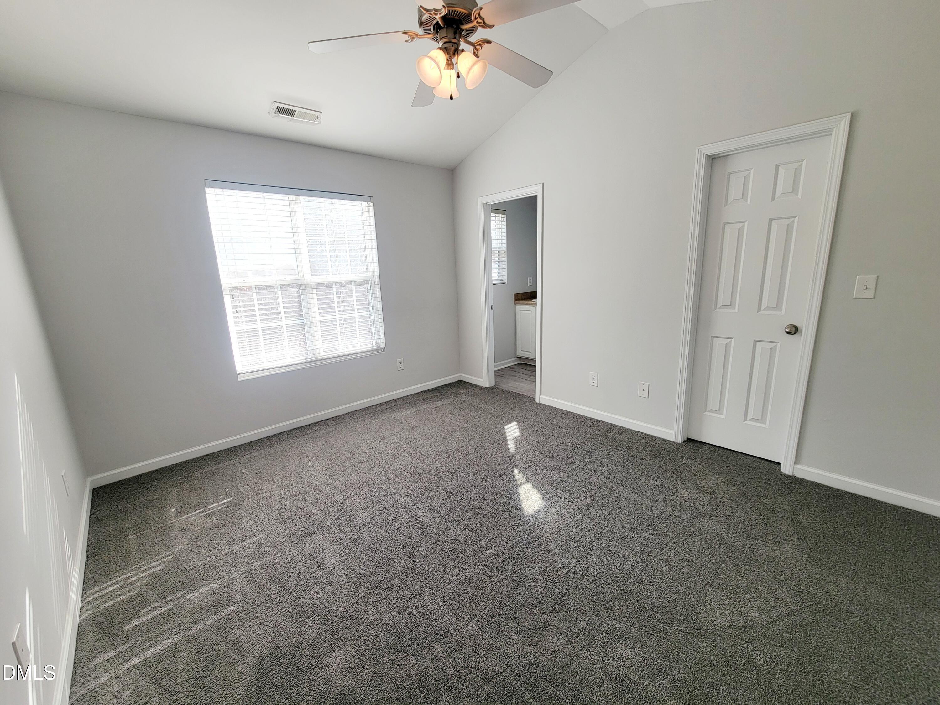 1407 Plexor Lane Knightdale, NC 27545 - Photo 18 of 43 a view of an empty room with a window