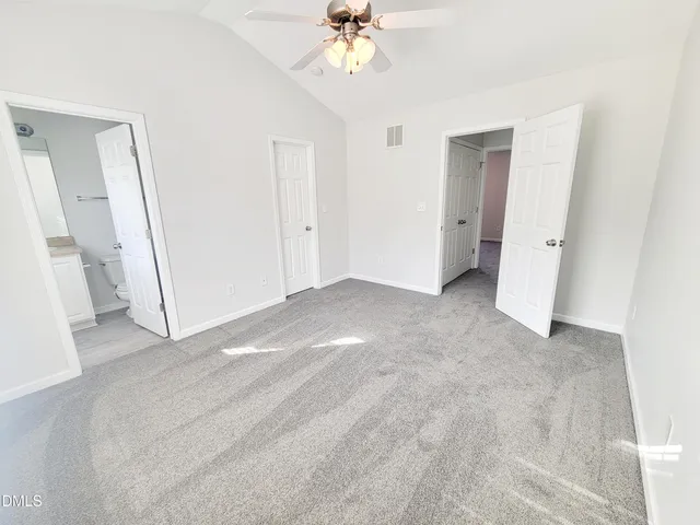 a view of a big room with carpet