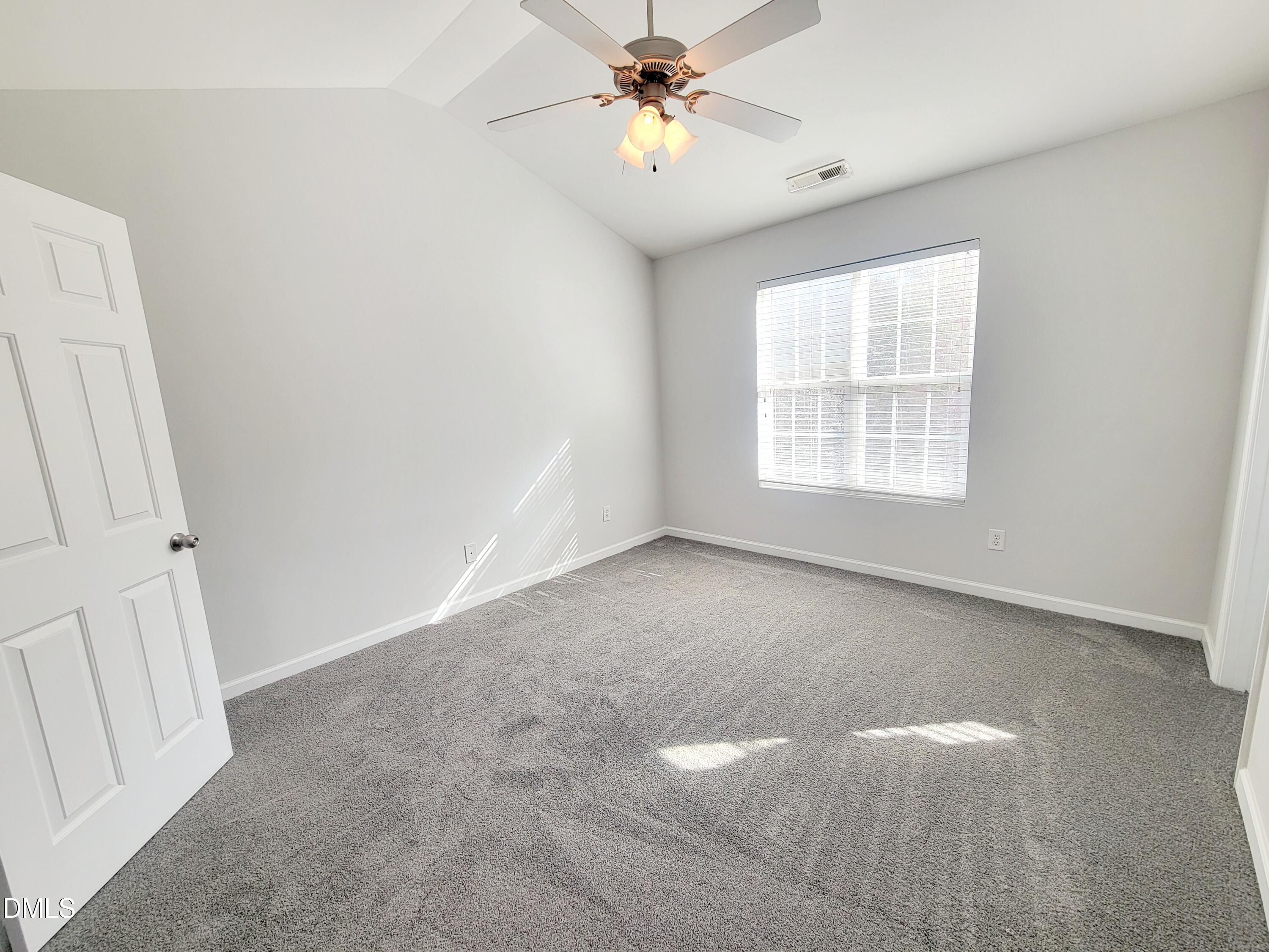 1407 Plexor Lane Knightdale, NC 27545 - Photo 21 of 43 a view of an empty room with a window