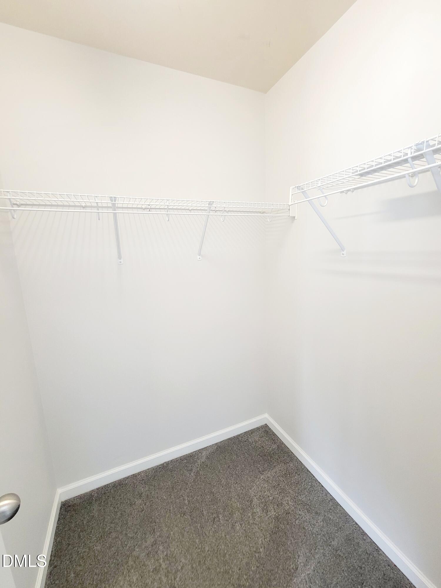 1407 Plexor Lane Knightdale, NC 27545 - Photo 23 of 43 a view of a room with racks on the wall