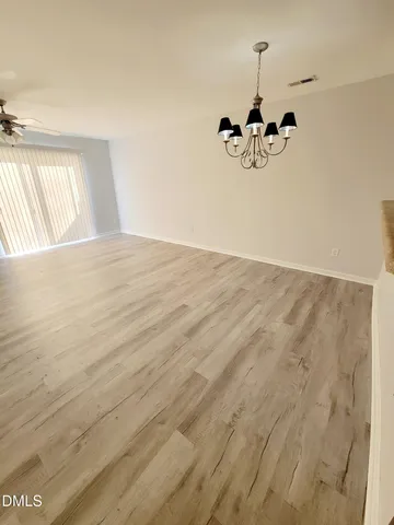 a view of empty room with windows