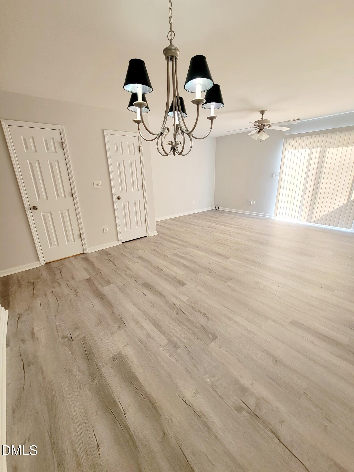1407 Plexor Lane Knightdale, NC 27545 - Photo 9 of 43 a view of empty room with windows