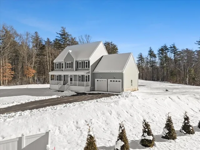 a view of side of snow with a yard