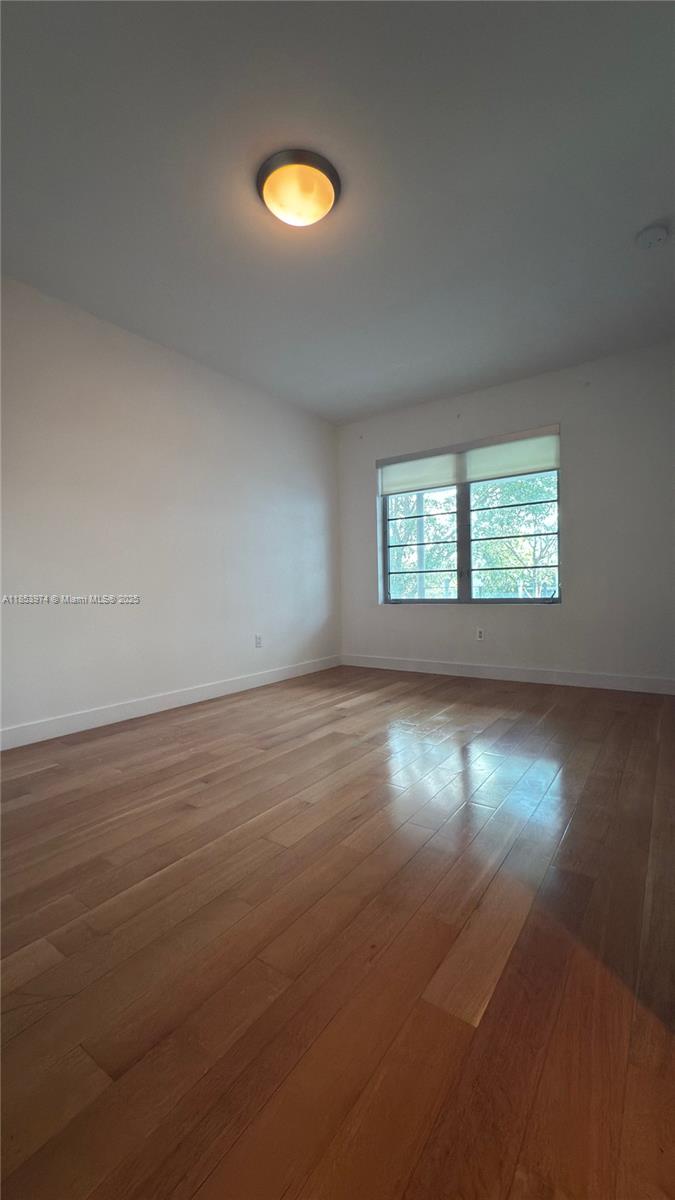 2021 Meridian Avenue, Unit 11 Miami Beach, FL 33139 - Photo 11 of 22 an empty room with a window