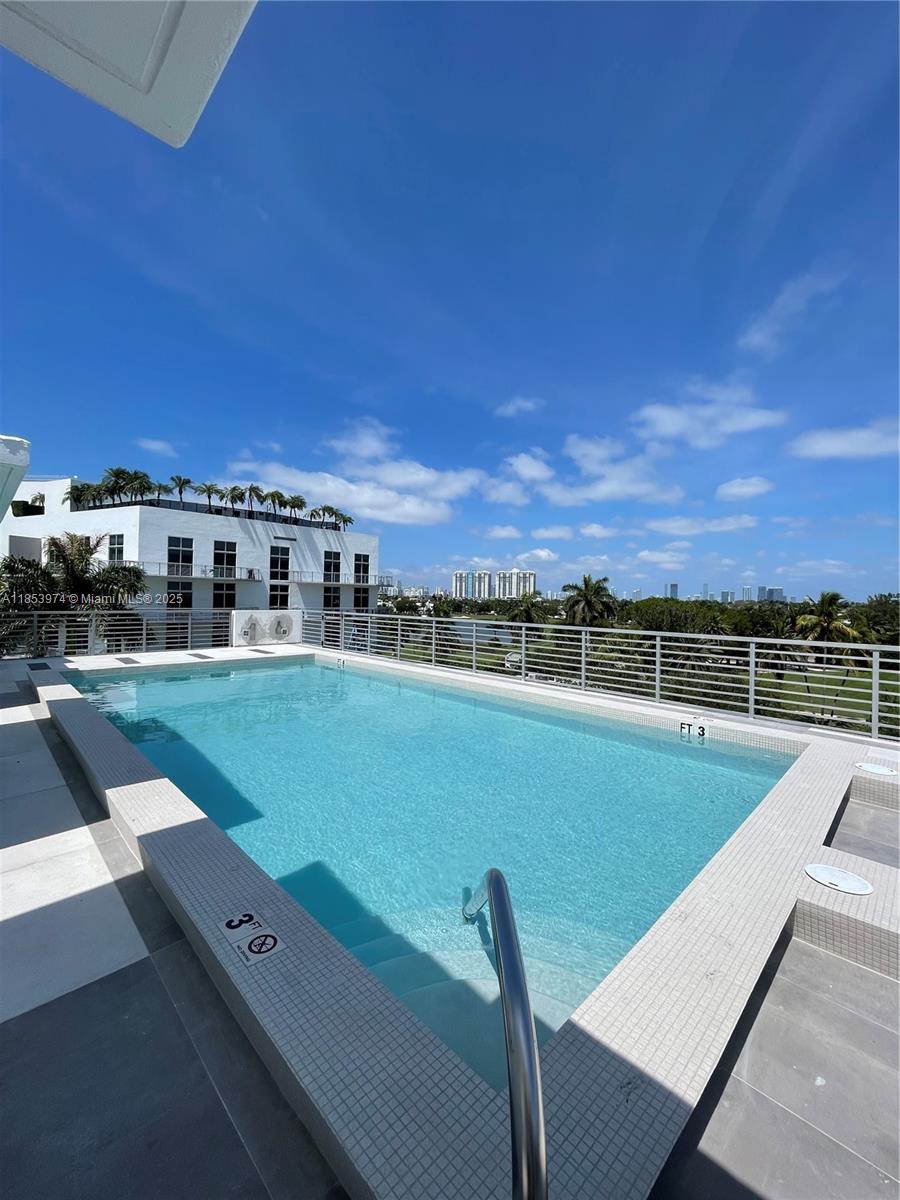 2021 Meridian Avenue, Unit 11 Miami Beach, FL 33139 - Photo 16 of 22 a view of a swimming pool and a terrace